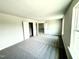 Large, carpeted bedroom with walk-in closet and natural light at 119 Southern Estates Dr, Sanford, NC 27330