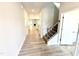 Inviting entryway with hardwood floors, staircase, and open view into the living spaces at 119 Southern Estates Dr, Sanford, NC 27330