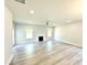 Bright and airy living room features a fireplace, light floors, and modern fixtures at 119 Southern Estates Dr, Sanford, NC 27330