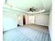 Spacious main bedroom with tray ceiling, ceiling fan, and neutral carpeting and paint at 119 Southern Estates Dr, Sanford, NC 27330