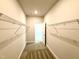 Large walk-in closet offering ample storage with wire shelving at 119 Southern Estates Dr, Sanford, NC 27330