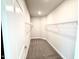 Carpeted walk-in closet with wire shelving for optimal storage solutions at 119 Southern Estates Dr, Sanford, NC 27330