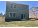 A view of the home's back exterior with a grass lawn at 132 N Keatts Winner Ct, Wilson's Mills, NC 27520