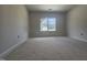 Bright bedroom with a large window offering natural light, providing a blank canvas for decor at 143 Mildred Place, Broadway, NC 27505