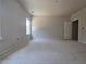 Light-filled bedroom featuring neutral walls and a large window, providing a serene atmosphere at 143 Mildred Place, Broadway, NC 27505