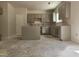 The new kitchen featuring sleek grey cabinets and a central island, awaiting countertops and appliances at 143 Mildred Place, Broadway, NC 27505