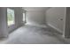 Spacious living room with natural light streaming through two windows, ready for your personal touch at 143 Mildred Place, Broadway, NC 27505
