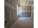 A spacious room featuring new drywall and a bright window, ready for personalized finishing touches at 143 Mildred Place, Broadway, NC 27505