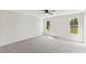 Spacious bedroom features neutral carpet, ceiling fan, and double-hung windows at 16 Monarch Trl, Selma, NC 27576