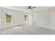 Bright bedroom features neutral carpet and double-hung windows with a view at 16 Monarch Trl, Selma, NC 27576