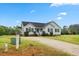 Well-manicured front yard and attractive exterior of this inviting single-story home at 16 Monarch Trl, Selma, NC 27576