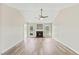 Bright living room with hardwood floors, fireplace, and neutral paint at 16 Monarch Trl, Selma, NC 27576