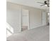 Bright main bedroom with neutral carpet adjoins the main bathroom at 16 Monarch Trl, Selma, NC 27576