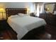 Spacious main bedroom features a king bed and hardwood floors at 1613 Beacon Valley Dr, Raleigh, NC 27604