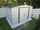 Exterior view of the shed in the backyard with white vinyl fencing at 1613 Beacon Valley Dr, Raleigh, NC 27604