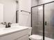 Bathroom featuring vanity and glass-enclosed shower with gray tile at 1636 Raven Falls Dr, Wendell, NC 27591