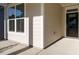 Home exterior featuring modern siding, large windows, and a covered front porch at 1636 Raven Falls Dr, Wendell, NC 27591