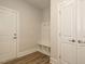 Charming mudroom with built-in bench and storage hooks at 1636 Raven Falls Dr, Wendell, NC 27591