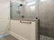 Modern bathroom with tiled walk-in shower and glass partition at 1636 Raven Falls Dr, Wendell, NC 27591