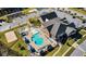 Aerial view of the community pool, lounge area, and playground, offering various recreational opportunities at 1643 Wimberly Rd, Apex, NC 27523