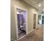 Bathroom featuring a shower with gray curtain, toilet, and vanity with gray cabinets and granite countertop at 1643 Wimberly Rd, Apex, NC 27523