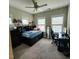 Comfortable bedroom featuring a ceiling fan, a computer desk, and abundant natural light at 1643 Wimberly Rd, Apex, NC 27523