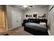 Cozy bedroom with carpet, neutral walls, ceiling fan, a wall-mounted bookcase and a closet at 1643 Wimberly Rd, Apex, NC 27523
