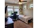 Cozy bedroom with a comfortable bed, desk and chair and ample natural light from the windows at 1643 Wimberly Rd, Apex, NC 27523