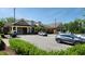 Exterior shot of a well-maintained clubhouse surrounded by parking and greenery at 1643 Wimberly Rd, Apex, NC 27523