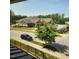 Community building with mature trees, manicured lawn, parking and view from the home's upper level at 1643 Wimberly Rd, Apex, NC 27523