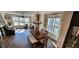 Sunlit dining area featuring a wooden table, bench seating, and views of the surrounding neighborhood at 1643 Wimberly Rd, Apex, NC 27523