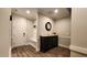 Bright entryway featuring hardwood floors, a coat rack, and stylish décor at 1643 Wimberly Rd, Apex, NC 27523