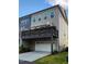 Townhome featuring a spacious deck over garage, ideal for outdoor enjoyment at 1643 Wimberly Rd, Apex, NC 27523