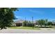 Well-maintained building exterior features manicured landscaping and clear blue skies at 1643 Wimberly Rd, Apex, NC 27523