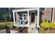 Cozy front porch with seating and landscaping, perfect for relaxing outdoors at 1643 Wimberly Rd, Apex, NC 27523
