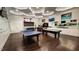 Recreation room featuring a ping pong table, a pool table and other games for leisure activities at 1643 Wimberly Rd, Apex, NC 27523