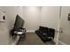Entertainment room featuring comfortable seating, gaming console, and large TVs for an immersive experience at 1643 Wimberly Rd, Apex, NC 27523