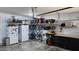 Organized garage space featuring shelving, storage containers, a refrigerator and bikes for easy storage at 1643 Wimberly Rd, Apex, NC 27523