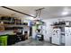 Spacious garage featuring ample shelving, a spare refrigerator, and room for storage or hobbies at 1643 Wimberly Rd, Apex, NC 27523