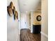 Hallway featuring stylish decor, bench, and hardwood floors at 1643 Wimberly Rd, Apex, NC 27523
