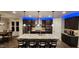 Modern kitchen with granite countertops, stainless steel appliances, and dark wood cabinets at 1643 Wimberly Rd, Apex, NC 27523