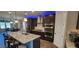 Well-equipped kitchen featuring an island, stainless steel appliances, open layout, and modern design at 1643 Wimberly Rd, Apex, NC 27523