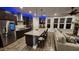 Open kitchen with granite counters, island seating, stainless appliances and seamless flow into living area at 1643 Wimberly Rd, Apex, NC 27523