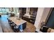 Gourmet kitchen showcasing a granite island with seating, stainless steel appliances, and open layout at 1643 Wimberly Rd, Apex, NC 27523
