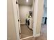 Functional laundry room features a full-size washer and dryer with tile flooring at 1643 Wimberly Rd, Apex, NC 27523