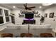 Comfortable living room with fireplace, TV on shelves, and neutral-toned walls and decor at 1643 Wimberly Rd, Apex, NC 27523