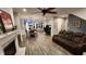 Spacious open-concept living area featuring fireplace, dining set and comfortable seating at 1643 Wimberly Rd, Apex, NC 27523