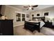 Comfortable main bedroom featuring neutral tones, plush carpet, and three bright, white trimmed windows at 1643 Wimberly Rd, Apex, NC 27523