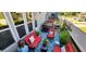 Charming outdoor patio with comfortable seating, vibrant decor, and a grill for outdoor entertaining at 1643 Wimberly Rd, Apex, NC 27523