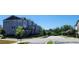 Charming townhomes with unique architecture line the street of this desirable neighborhood under a sunny sky at 1643 Wimberly Rd, Apex, NC 27523
